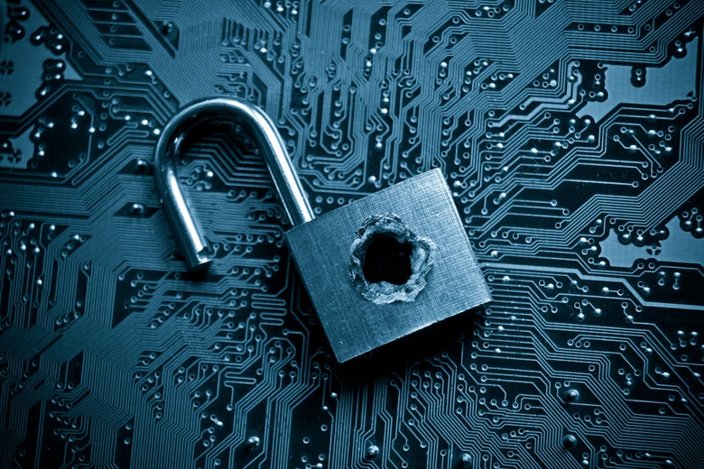 A busted lock on top of computer parts.